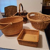 Group shot of four wicker baskets showing shapes and sizes