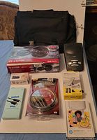 Overall view showing all boxed electronics and laptop bag