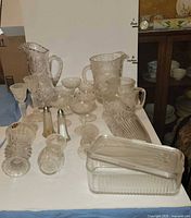 Front angled view showing majority of glass items grouped together