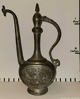 Full left profile of ewer showing spout, handle, overall form against size scale