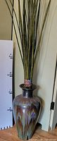 Full view of glazed floor vase with faux bamboo