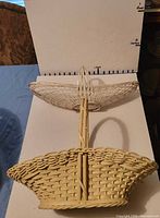 Side view showing both baskets with scale backdrop