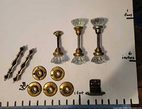 All hardware pieces arranged with scale for size reference