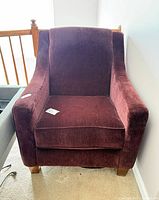 Front view of burgundy Ashley armchair