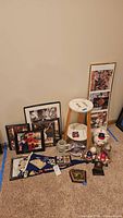 Wide shot showing all memorabilia grouped on carpet