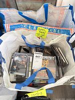 Bag containing numerous jewel case CDs with sticky note "Classic Rock 70s"