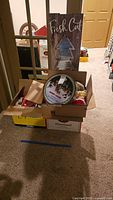 Overview of boxes containing ornaments and wood sign
