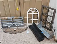 All seven wall decor pieces grouped on floor