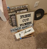 Group of farmhouse wall signs leaning together
