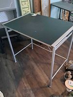 Full view of folding table showing top and legs