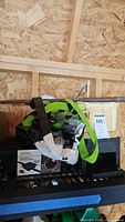 Pile showing FLEX-Drain box, straps, possible birdhouse and hardware
