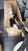 Box containing sticks and gear
