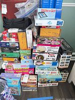 Full stack of puzzle boxes with storage mat on top