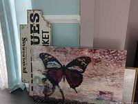 All three wall art pieces leaning against wall