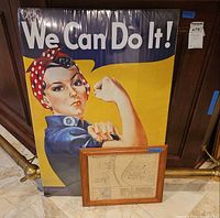 Rosie poster in shrink wrap standing behind framed map print
