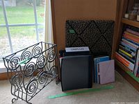 Overall lot: metal rack, memo board, stack of planners and binders