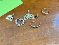 All six jewelry pieces laid out on table
