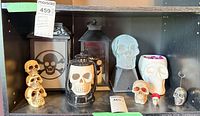 Entire shelf showing all nine skull-themed décor items