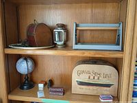 All items on bookshelf shelves showing relative sizes and arrangement