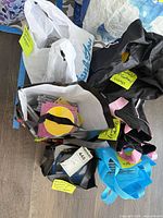 Four tote bags containing numerous CD jewel cases and paper sleeves