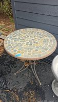 Top view of round mosaic tile tabletop