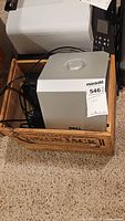 Dell A525 powered subwoofer in wooden crate with cables visible