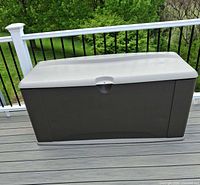 Front view of Rubbermaid deck box closed on deck