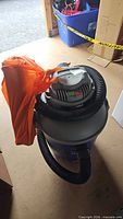 Full view of Shop-Vac with hose and orange bag attached