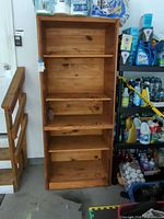 Front view of solid wood bookshelf with shelves