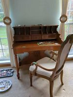 Desk with hutch, chair and some jewelry visible