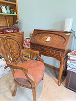 Desk and armchair together showing scale and style
