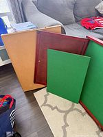 Tri-fold puzzle table with one side panel removed and green felt boards displayed