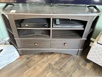 Front view showing shelves and drawers