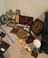 Group view of assorted beer signs, lamp, train caboose