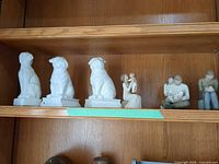 Shelf view showing all five figurines