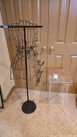 Full view of wire mannequin and accent table