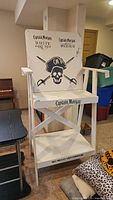Full view of Captain Morgan wooden lifeguard chair showing branding and structure