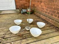 Full view of 5-light chandelier lying on deck