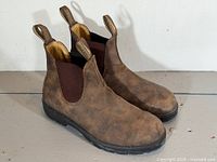 Pair of brown Blundstone Chelsea boots side view