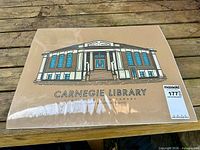 Full view of shrink-wrapped Carnegie Library print on tabletop