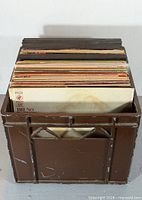 Full milk crate filled with upright LP records
