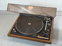 Full view of Dual 604 turntable with dust cover open