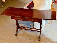Full view of mahogany drop-leaf sofa table, leaves extended