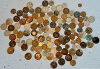 Overhead view of entire spread of assorted world coins