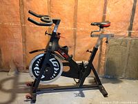 Full view of Luxor spin bike showing frame, flywheel, seat and handlebars