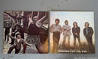 Front jackets of both LPs side by side