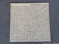 Front album cover with white grid design and title text