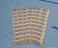 Fan of ticket sheets showing full lot