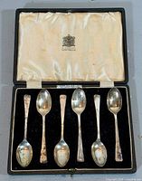 Open case showing six sterling silver teaspoons