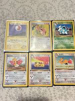 All six 1st Edition Pokémon cards laid out in two rows